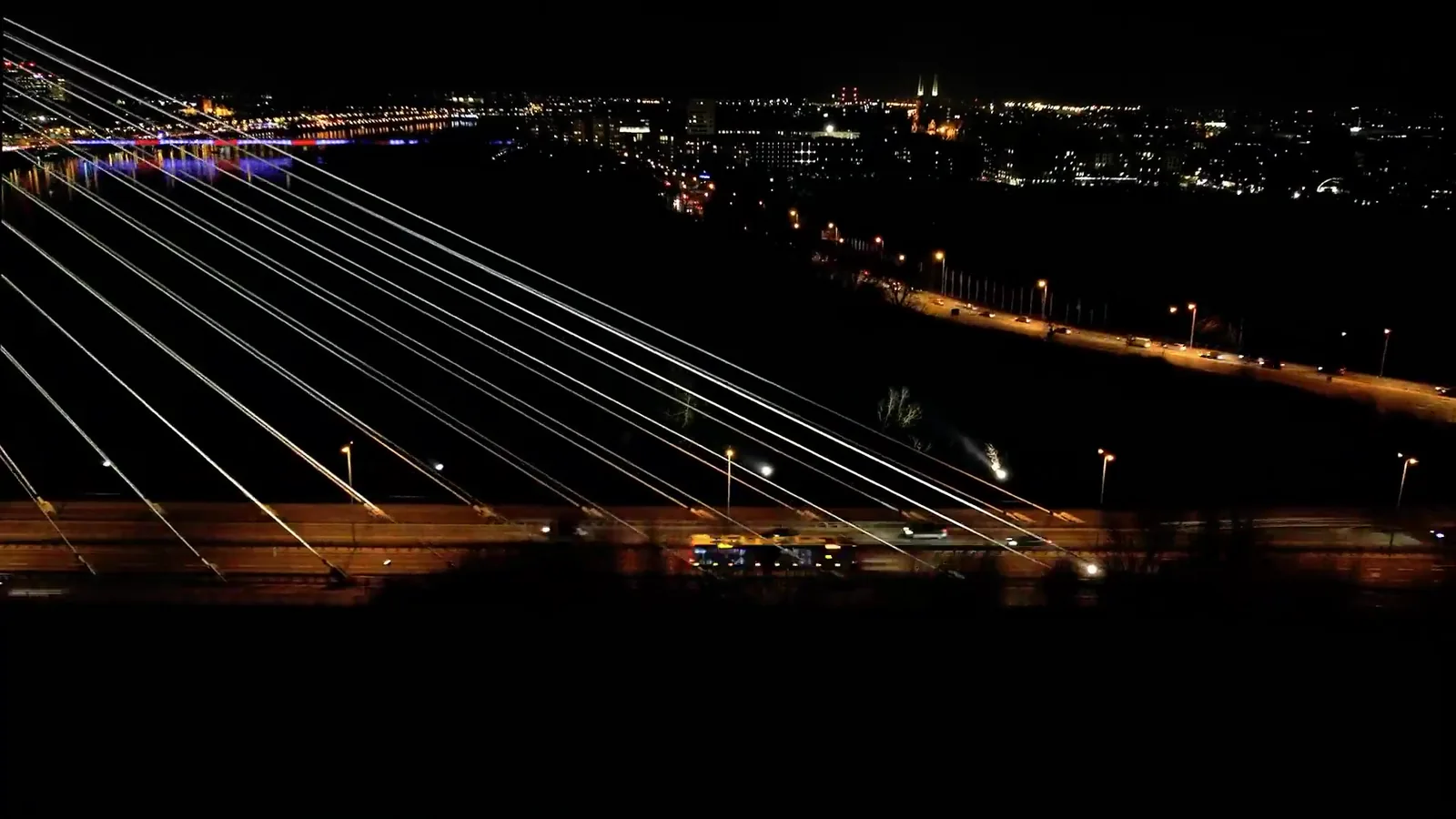 Illuminated city bridge at night